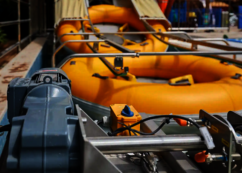 Front machine area of the raft conveyor with control technology and waiting slide rafts.